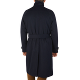The back view of a man wearing a Studio 73 Navy Wool Cashmere Raglan Coat.