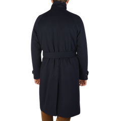 The back view of a man wearing a Studio 73 Navy Wool Cashmere Raglan Coat.