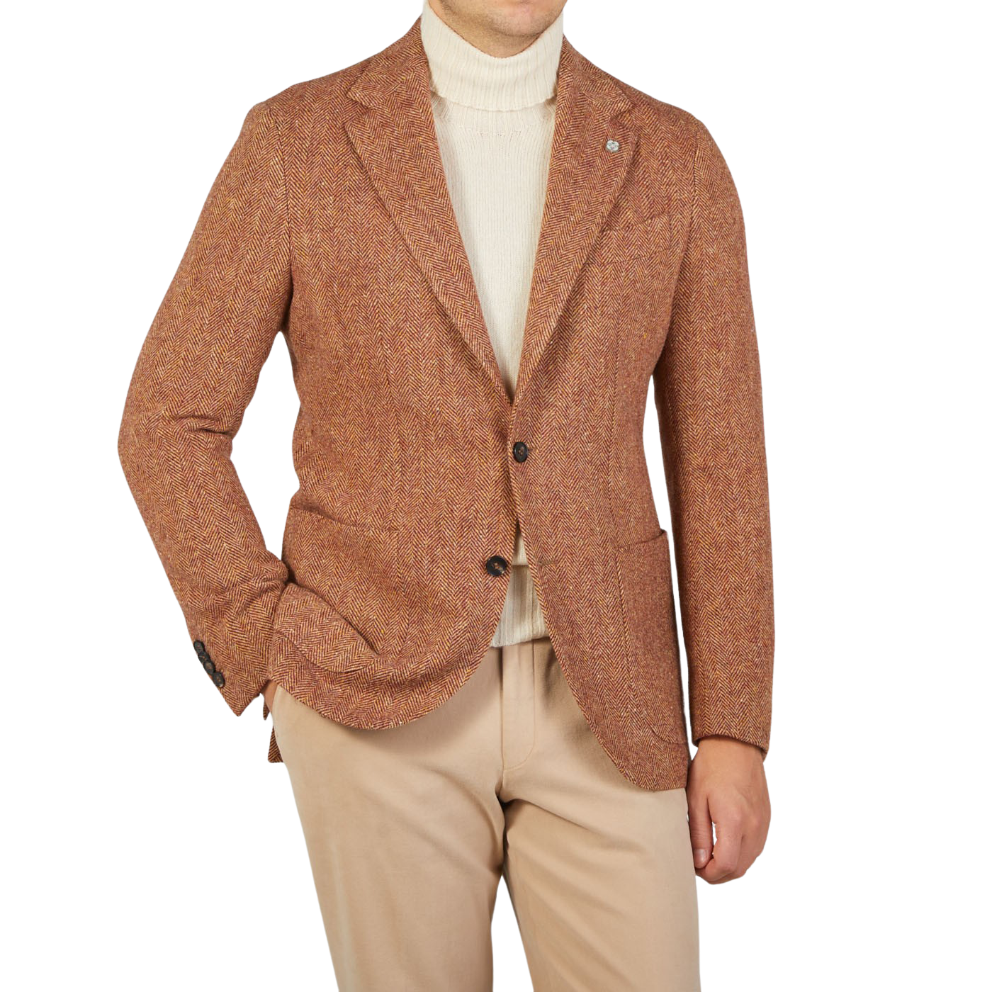 A man wearing a Studio 73 Orange Herringbone Wool Tweed Blazer and tan pants.