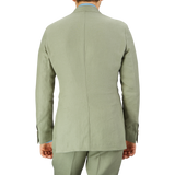 Person in a Sage Green Canapa Hemp DB Suit crafted from Studio 73's canapa hemp linen, viewed from the back.