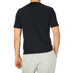 The man is wearing a Sunspel Black Classic Cotton T-Shirt.