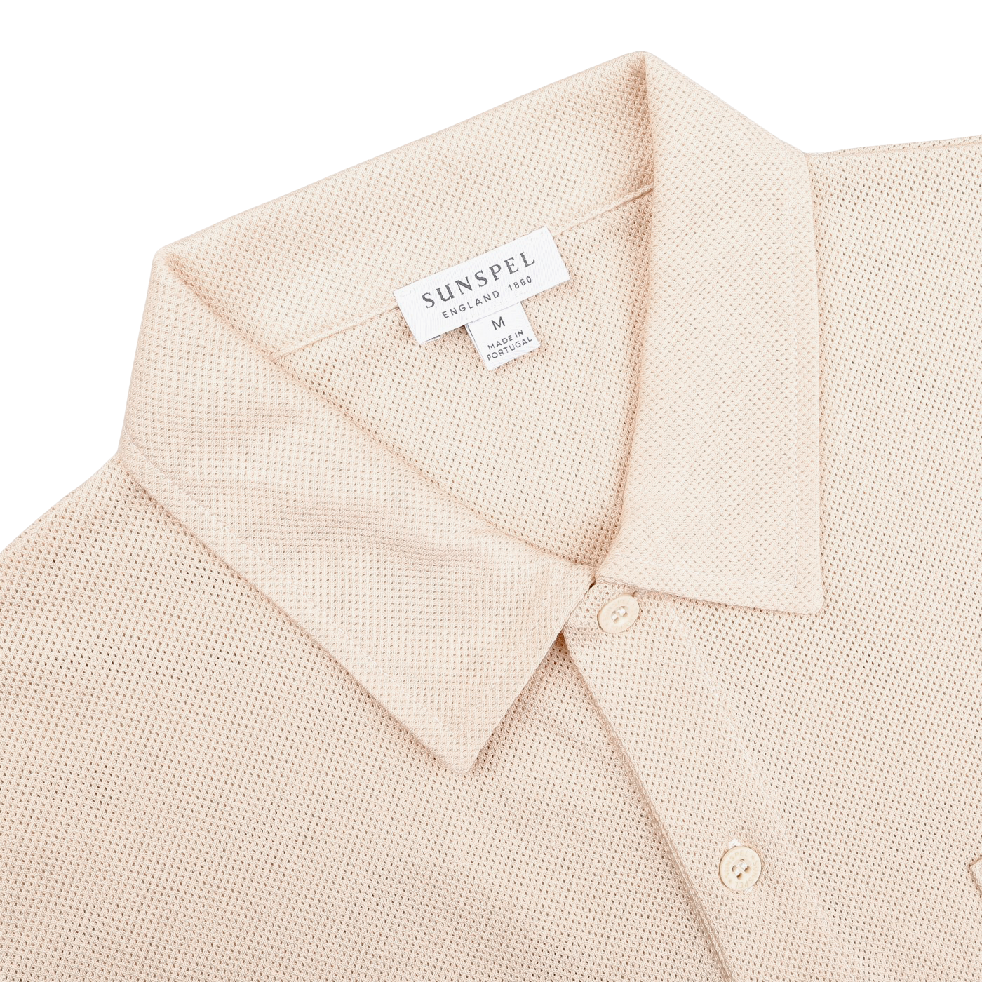 The Ecru Beige Cotton Riviera Polo Shirt by Sunspel is crafted in breathable cotton mesh with a buttoned collar, featuring a size M label. Made in Portugal, it offers both style and comfort.