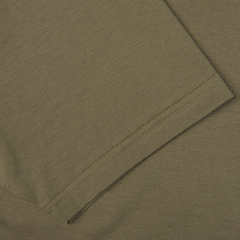 Close-up of the Khaki Green Classic Cotton T-Shirt fabric by Sunspel, featuring a crew neck crafted from soft cotton and highlighting the sleeve stitching detail—a true wardrobe foundation.