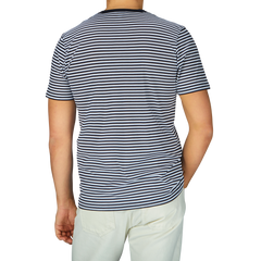 The man is seen wearing a comfortable Navy White Striped Classic Cotton T-Shirt from Sunspel.