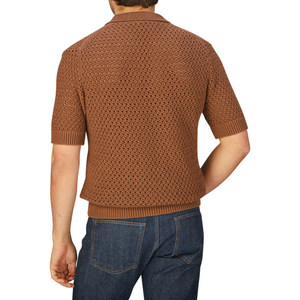 The back view of a man wearing a luxurious, Nougat Brown Egyptian cotton chunky knit polo shirt by Sunspel.