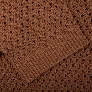 A close up of a luxurious Sunspel Nougat Brown Cotton Chunky Knit Polo Shirt.