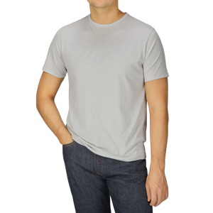 A man in a Sunspel Smoke Grey Classic Cotton T-Shirt and jeans.