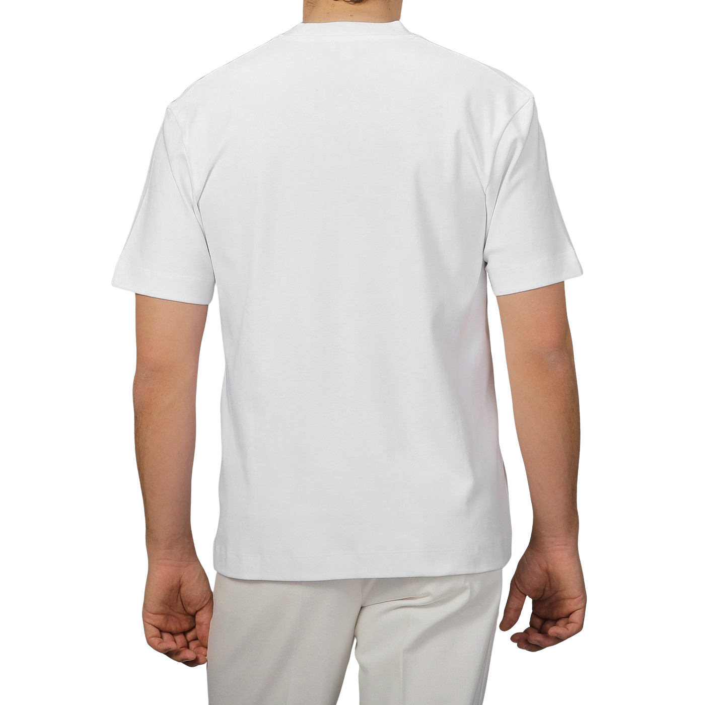 A person wearing Sunspel's White Supima Cotton Relaxed Fit T‑shirt with light-colored pants is shown from the rear against a gray background.