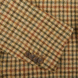 A close up of a Tagliatore Beige Houndstooth Wool Tweed Vesuvio Blazer featuring virgin wool.