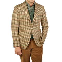 A man wearing a Beige Houndstooth Wool Tweed Vesuvio Blazer by Tagliatore.