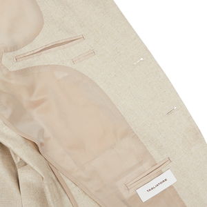A close up of a slim fit Beige Melange Silk Twill Vesuvio Blazer with a pocket by Tagliatore.