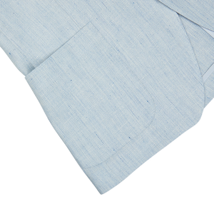 Light blue textured linen-wool blend tie on a white background from Tagliatore.
