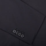 A Tagliatore Midnight Navy Super 110s Wool Suit Jacket, crafted from worsted semi-shiny 100% wool fabric, showcasing a stylish button detail.