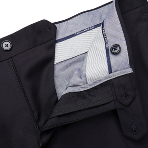 A close up of the pocket of a Midnight Navy Super 110s Wool suit trouser made by Tagliatore.