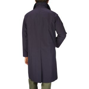 The man is wearing a Tagliatore Navy Blue Cotton Nylon Trench Coat.