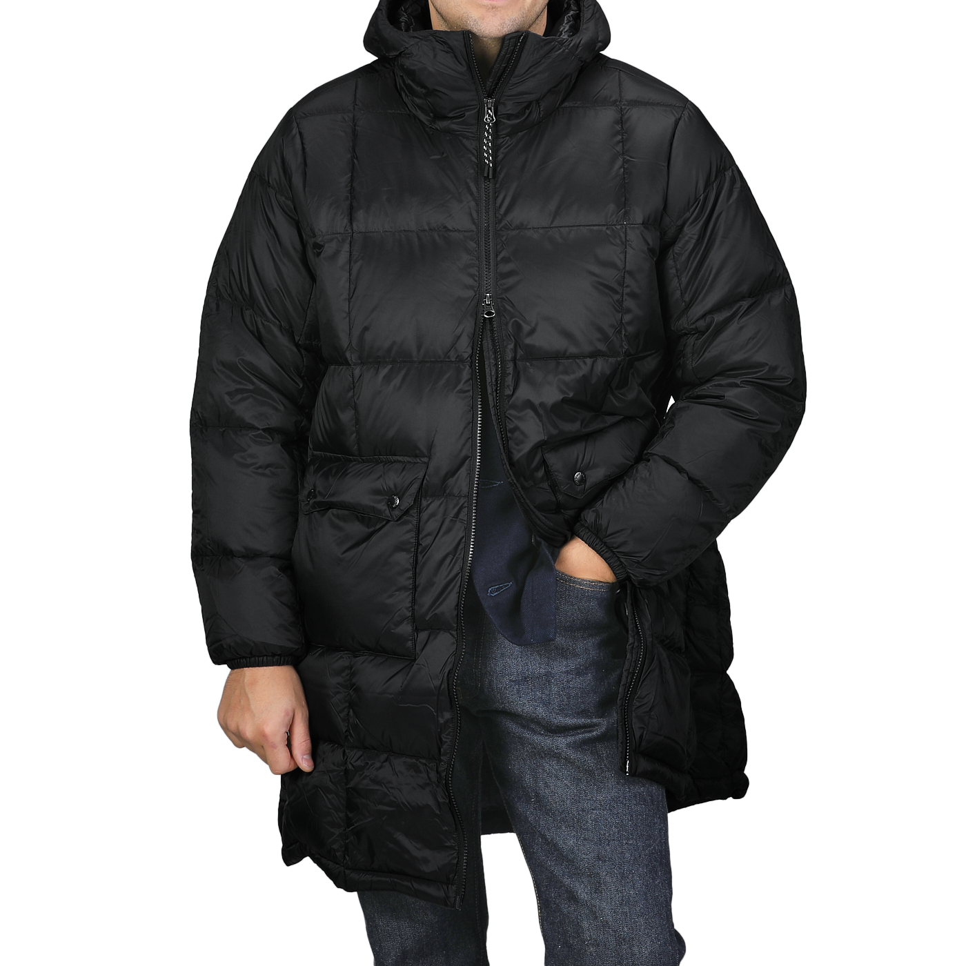 A person is wearing the Taion Black Nylon Down Padded Parka, with its hooded design and durable nylon exterior. Their hands are tucked into the jacket’s pockets, and the parka is zipped up to provide both comfort and style.