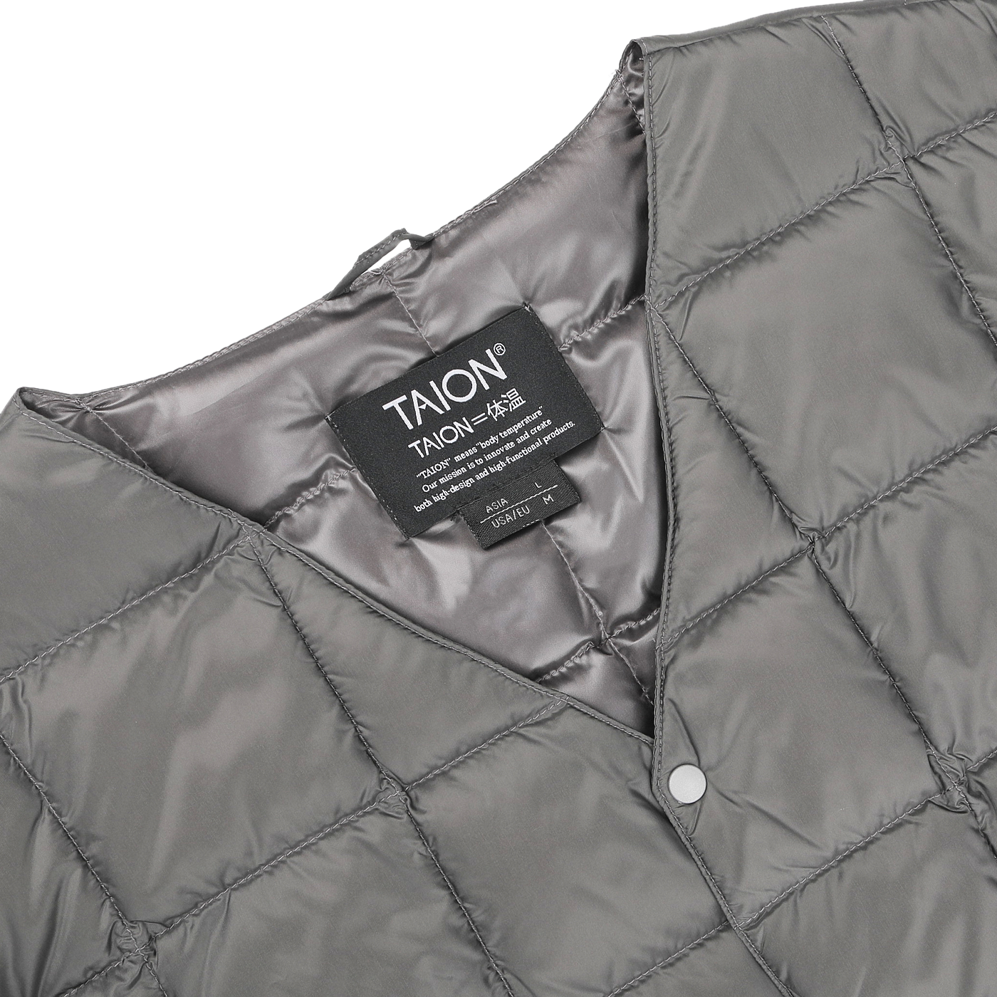 This Charcoal Grey Nylon Down Padded Vest by Taion is crafted with high-density nylon and features a quilted design, complete with a visible brand label on the interior.