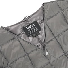 This Charcoal Grey Nylon Down Padded Vest by Taion is crafted with high-density nylon and features a quilted design, complete with a visible brand label on the interior.