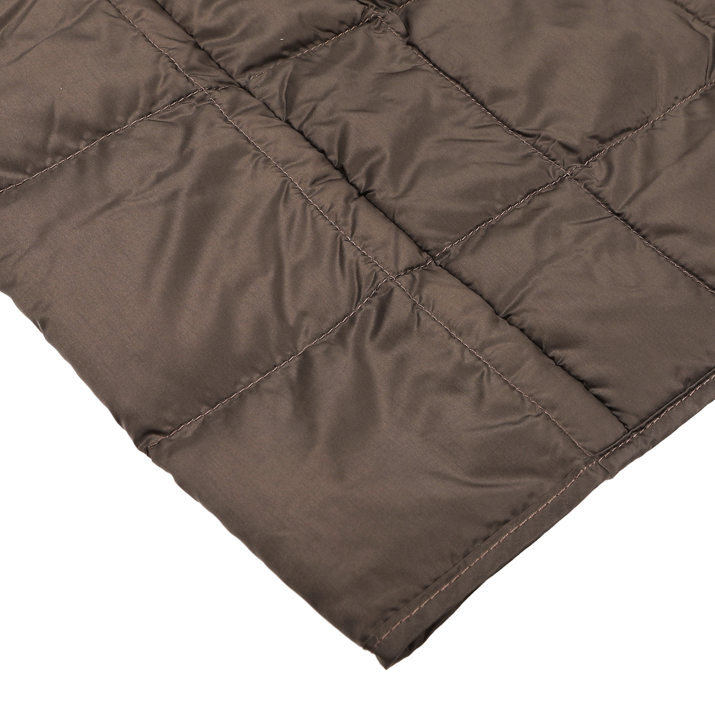 Close-up of the dark chocolate quilted fabric from Taion's Nylon Down Padded Vest, featuring stitched square patterns.