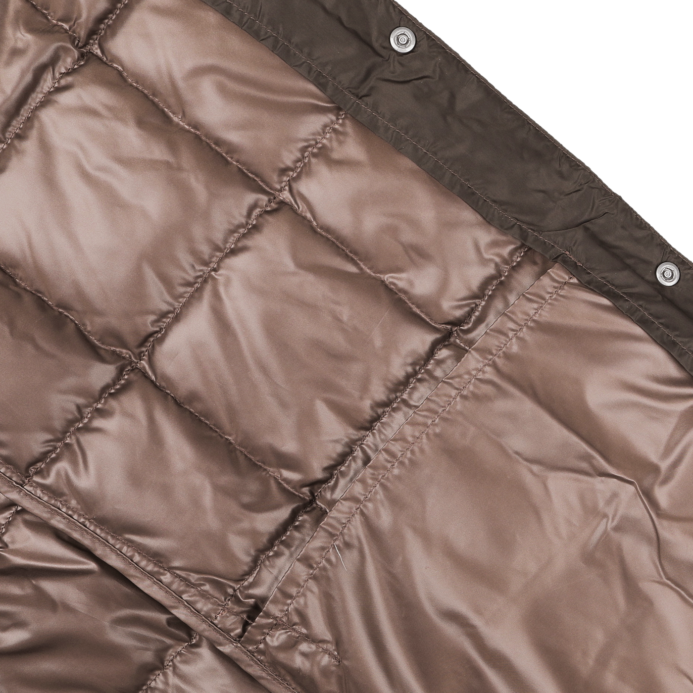 Close-up of the Dark Chocolate Nylon Down Padded Vest by Taion, featuring a high-density nylon construction with stitched square patterns. The design includes a zipper and metallic buttons along the edge, reminiscent of a puffy technical vest.