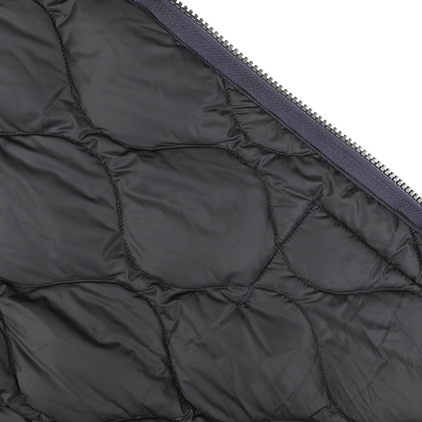 Close-up of the Taion Navy Blue Nylon Down Padded Zip Vest, showcasing a quilted design with a visible zipper along one edge, reminiscent of Japanese outerwear craftsmanship.