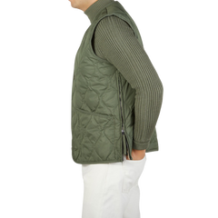 The back view of a man wearing a Taion Olive Green Nylon Down V-Neck Button Vest.