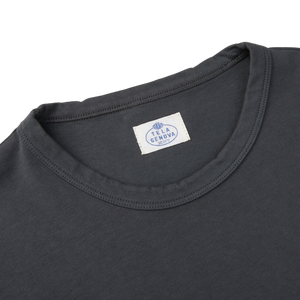 The back of an Asphalt Grey Cotton LS T-shirt with a Tela Genova label on it, representing the Italian brand.