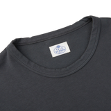 The back of an Asphalt Grey Cotton LS T-shirt with a Tela Genova label on it, representing the Italian brand.
