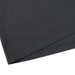 A close up of a black Asphalt Grey Cotton LS T-Shirt from Italian brand, Tela Genova.