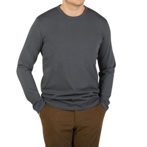 A man wearing the Tela Genova Asphalt Grey Cotton LS T-Shirt.