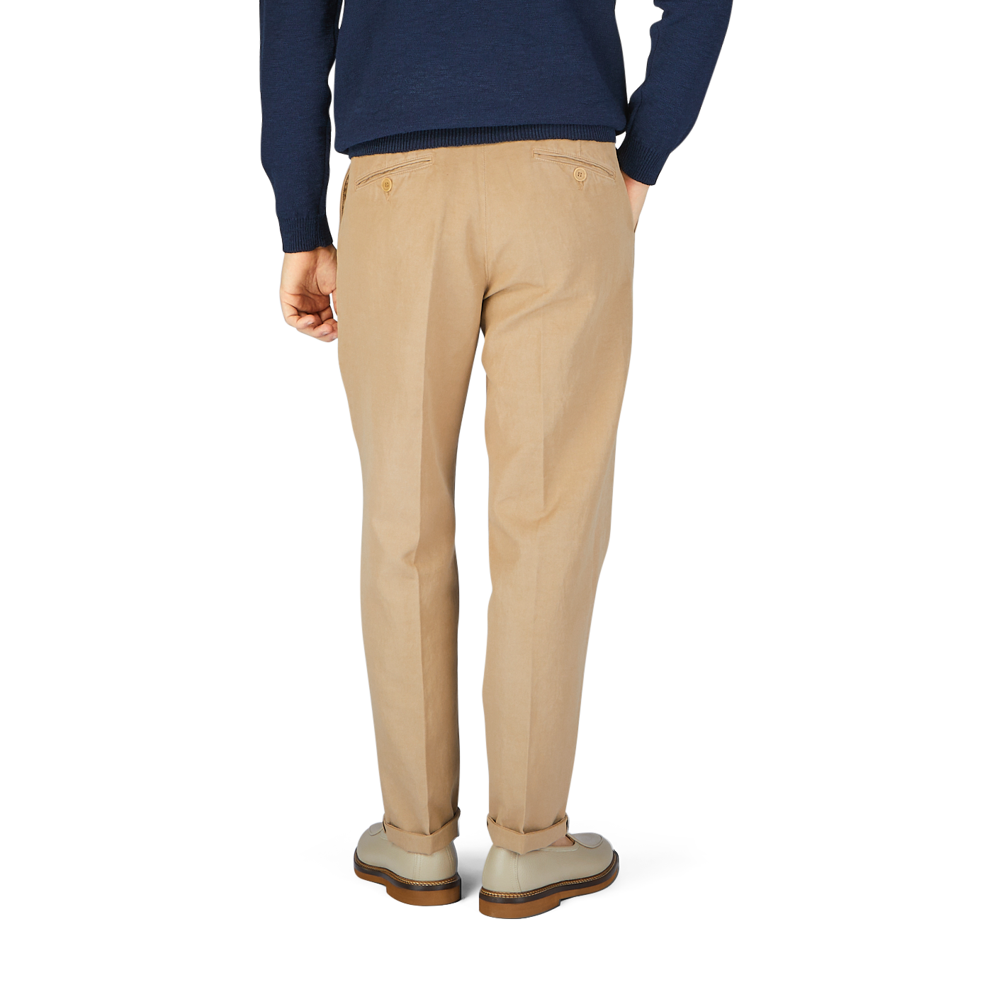 This is the back view of a man in Beige Cotton Linen Duilio Trousers from Tela Genova and a navy sweater.