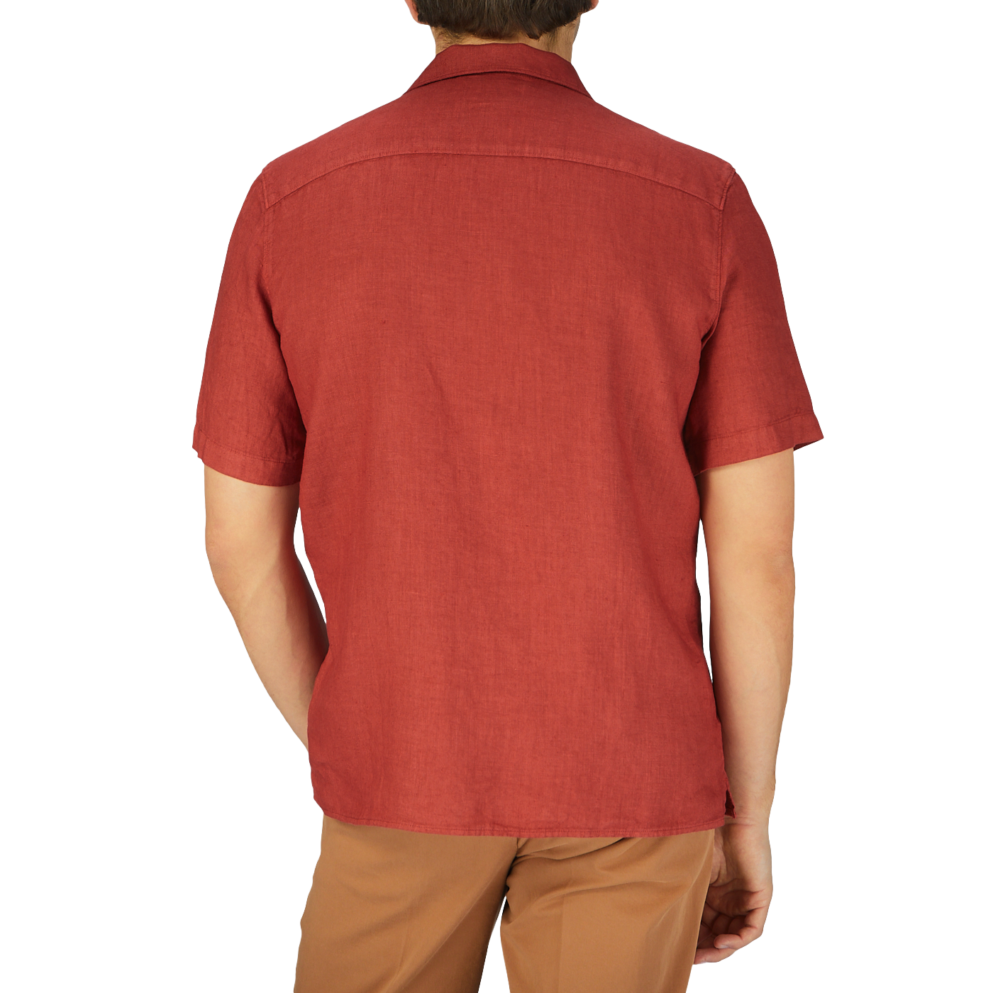 The back view of a man wearing a Brick Red Renato Linen Camp Collar Shirt by Tela Genova.