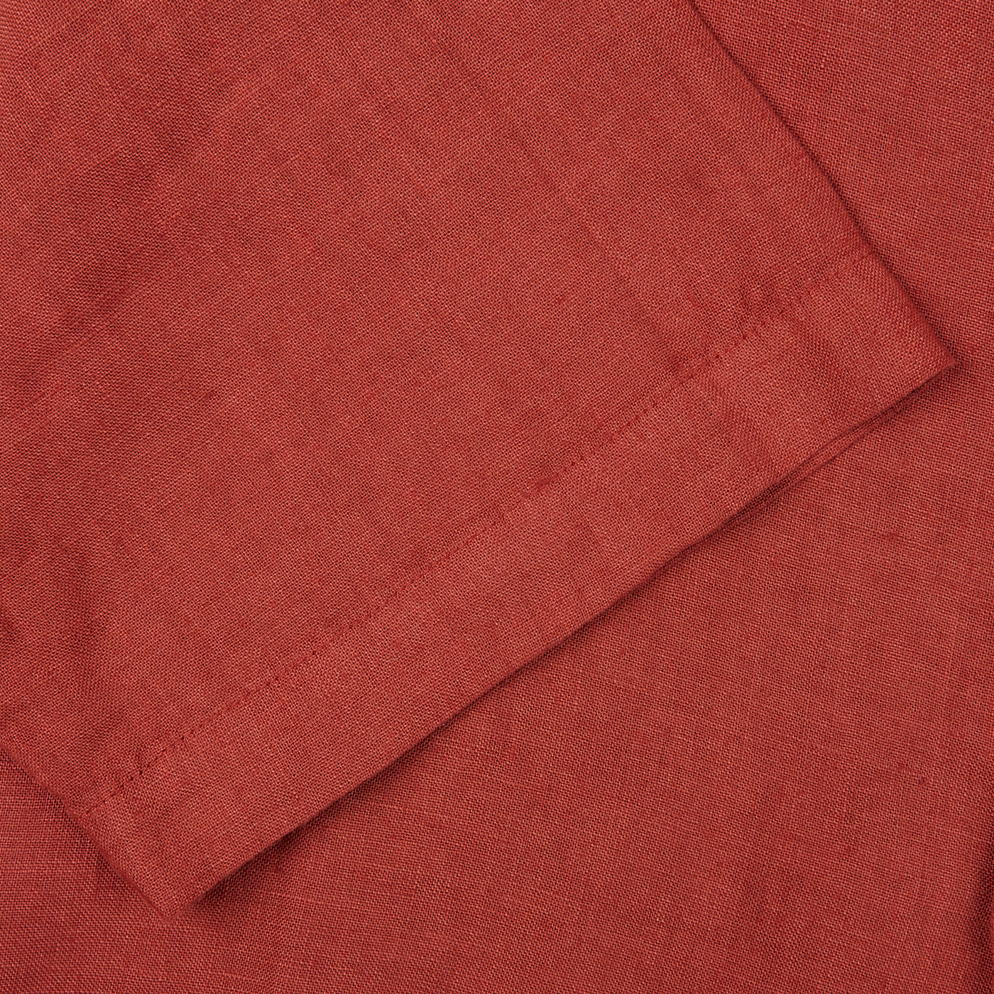 A close up image of a Brick Red Renato Linen Camp Collar Shirt by Tela Genova.