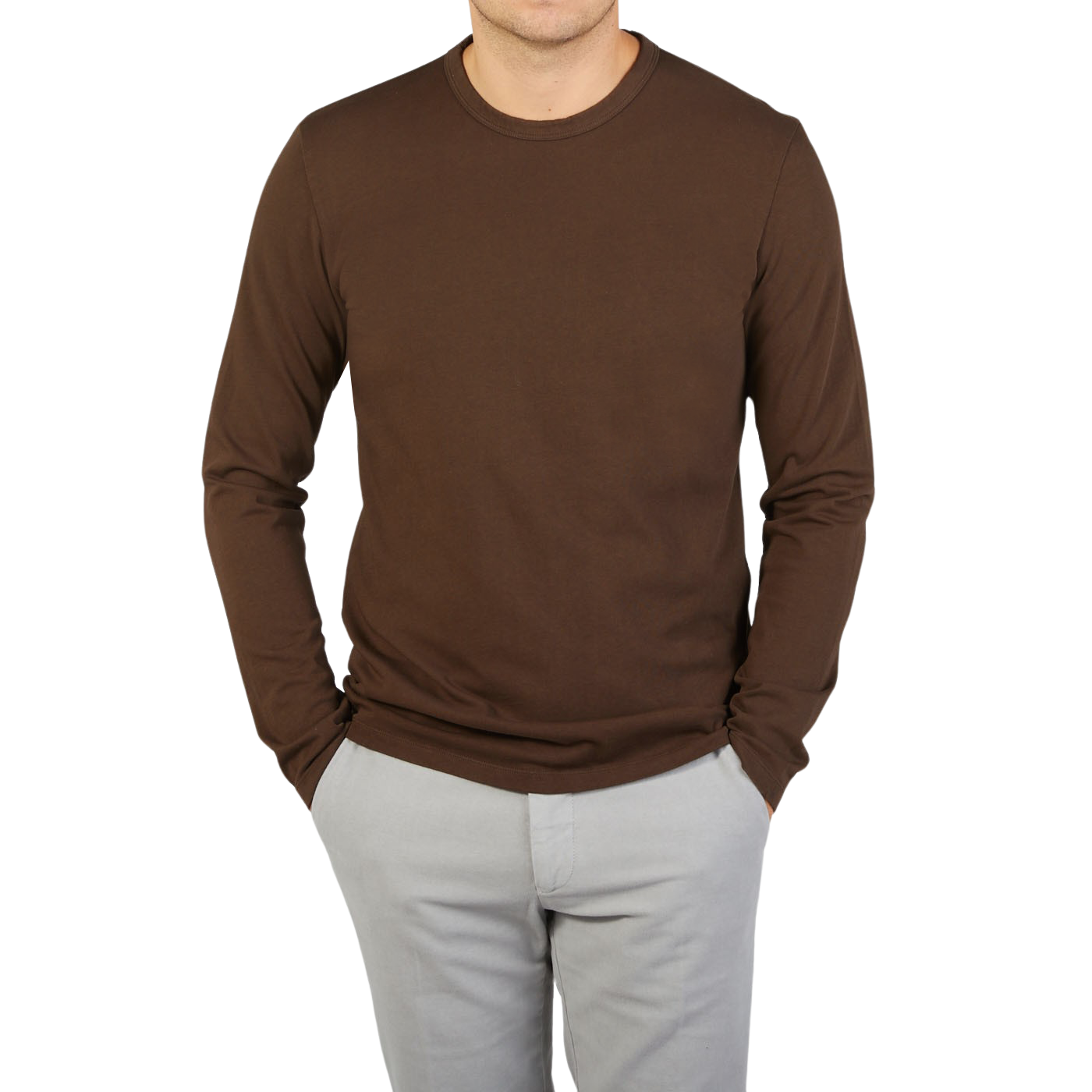 A man wearing a Tela Genova Dark Brown Organic Cotton LS T-Shirt.