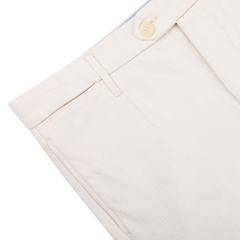 Close-up of Tela Genova's Ecru Beige Cotton Wool Berardo Trousers, featuring a button closure and belt loops for a regular fit.