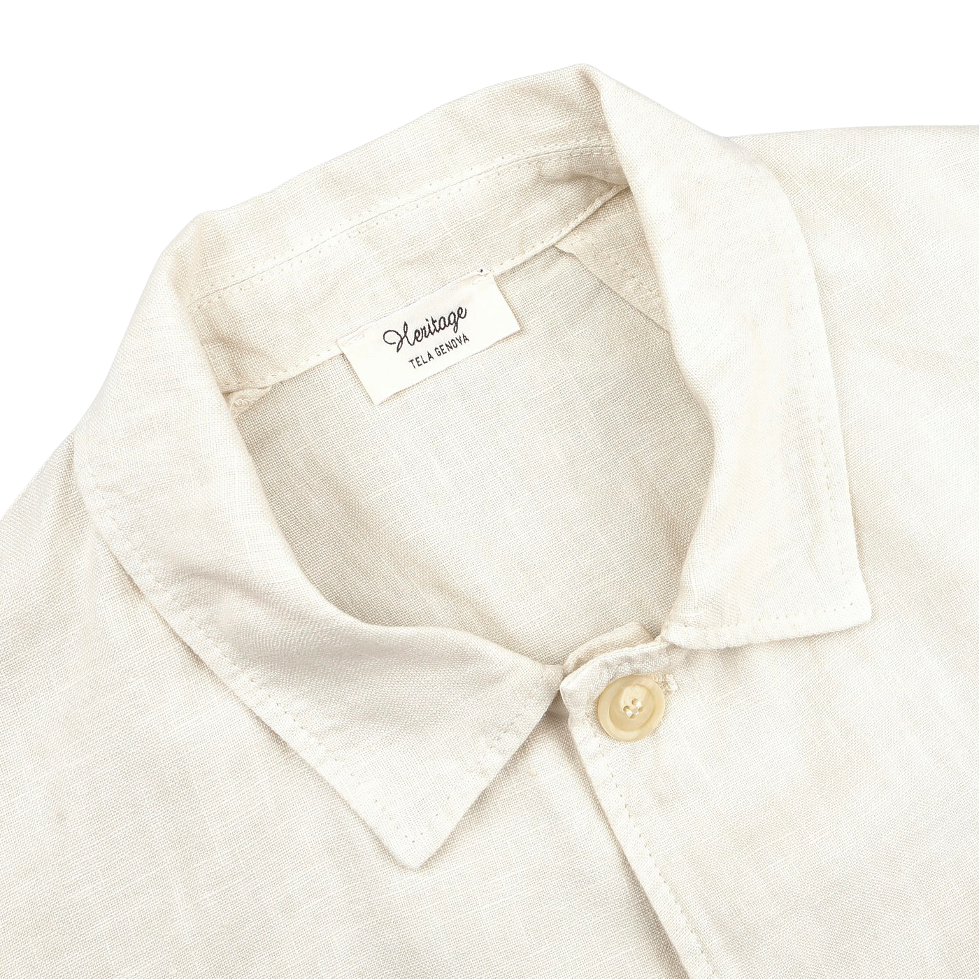 Close-up of an Ecru Pure Linen Camillo Jacket by Tela Genova, with a collar and button-up design, channeling a casual look reminiscent of a vintage overshirt.