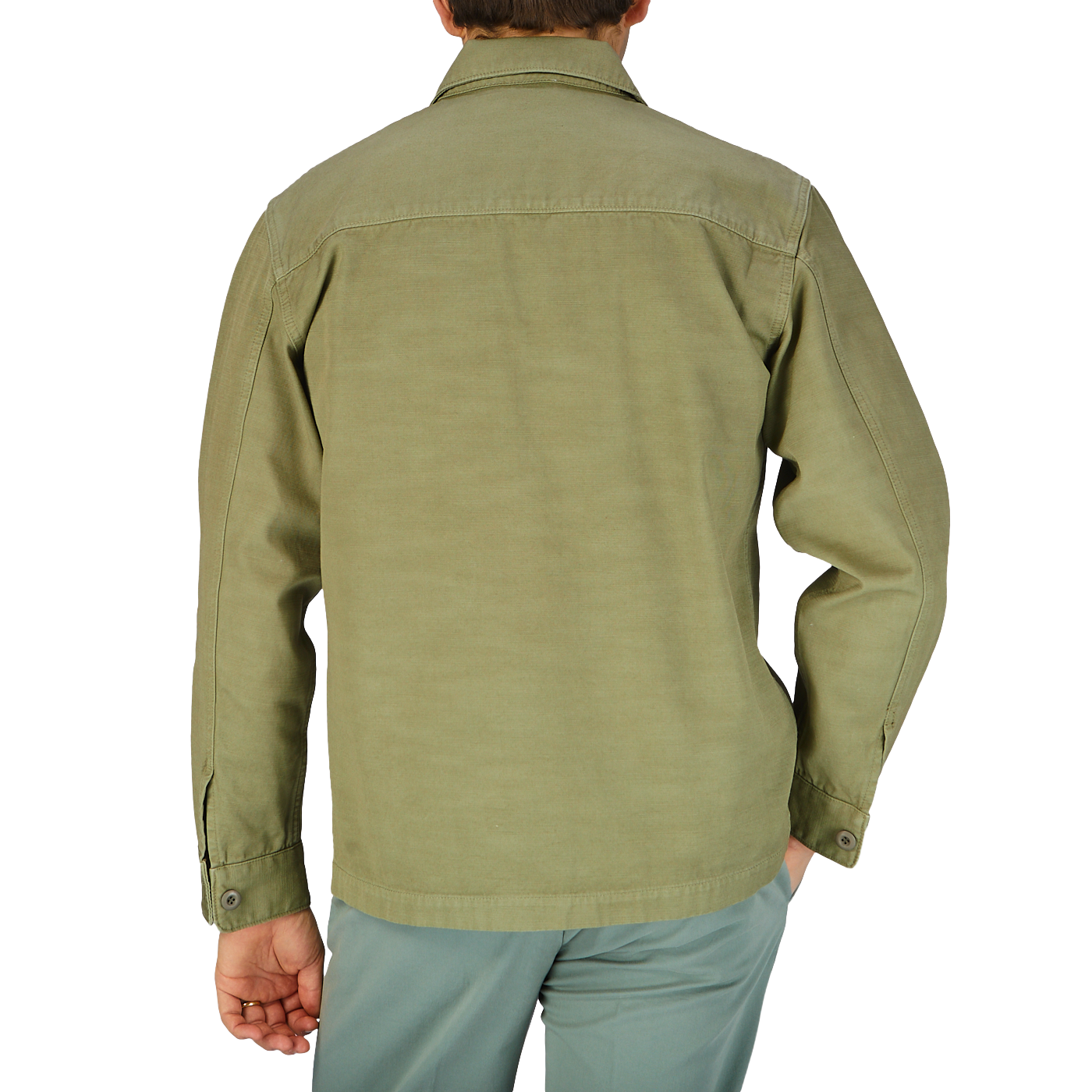 The back view of a man wearing a Grass Green Greto Cotton Overshirt by Tela Genova.