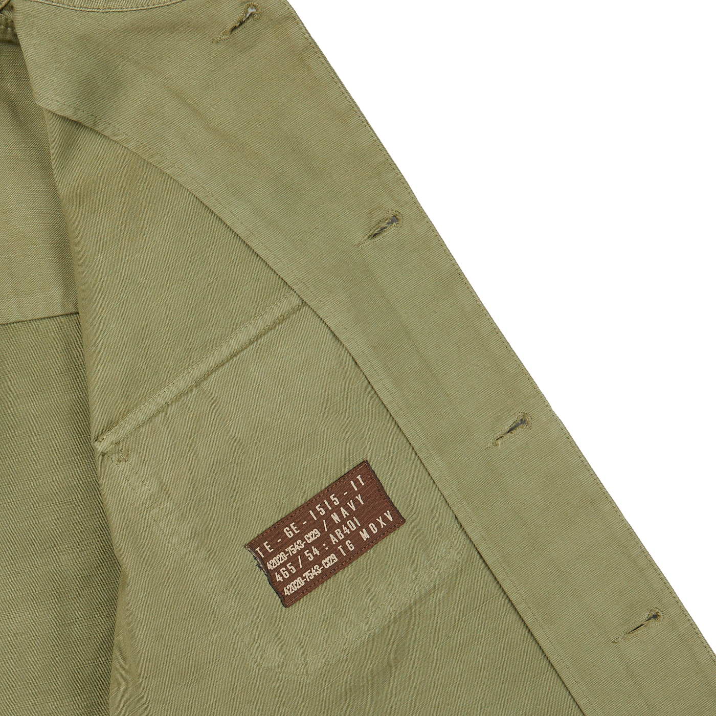 The pocket of a Grass Green Greto Cotton Overshirt with a brown label on it by Tela Genova.