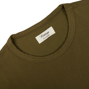 Military green LS T-shirt with a printed label on the neckline, made of organic heavy cotton by Tela Genova.
