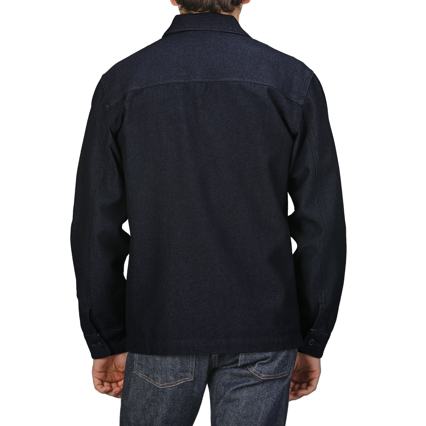 A person wearing a Navy Blue Wool Cotton Greto Overshirt by Tela Genova, paired with dark denim jeans, is shown from the back against a plain background, embodying a sophisticated casual look.