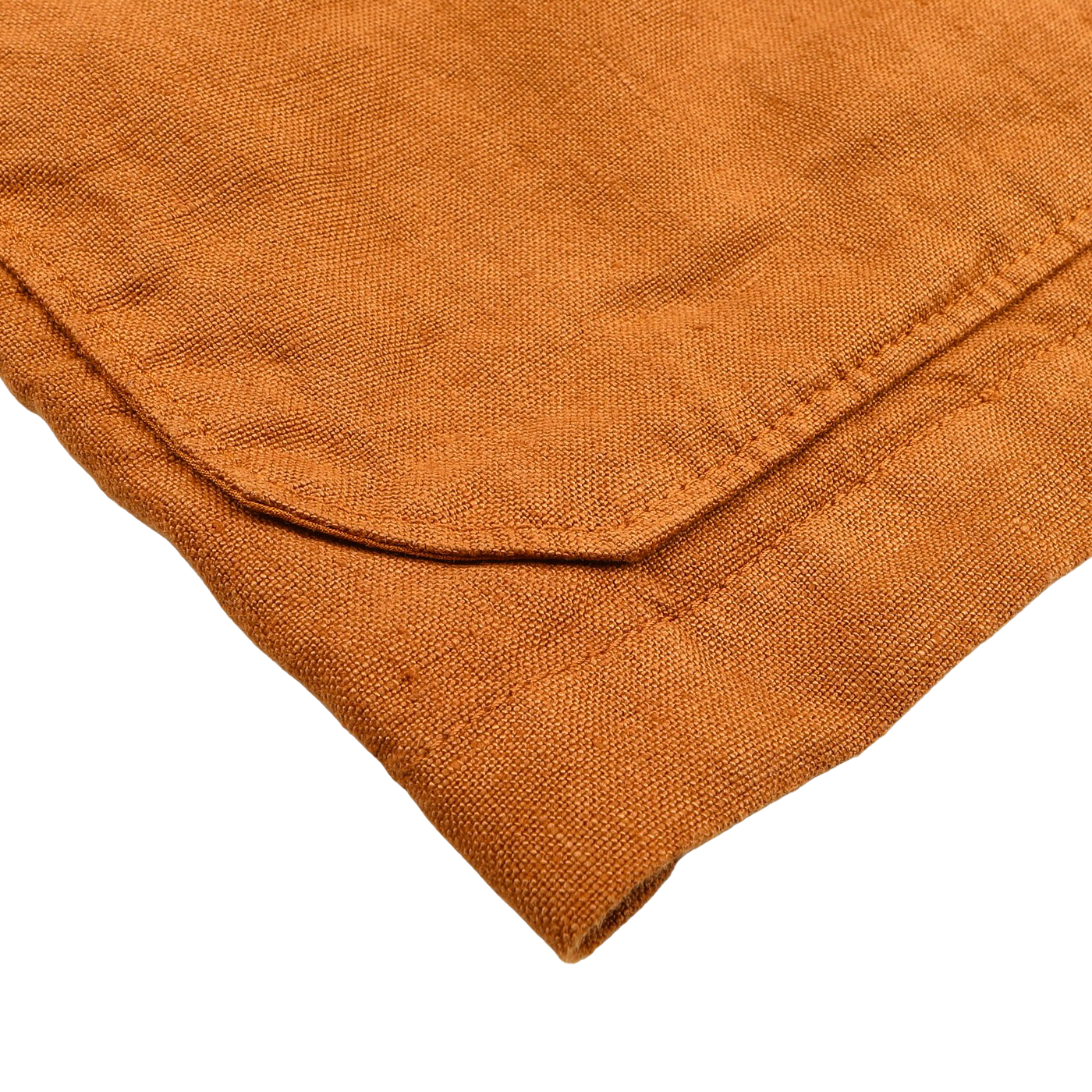 Close-up of a folded corner of rust-colored linen fabric, reminiscent of the stitching on Tela Genova's Tobacco Pure Linen Camillo Jacket, against a white background.