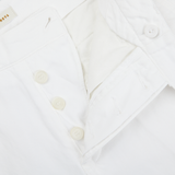 A close up image of Tela Genova White Cotton Linen Bermuda Shorts with buttons.