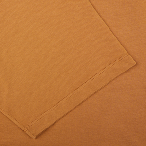 Brick Orange Heavy Organic Cotton T-Shirt with a detailed texture and neatly stitched edge, crafted from Tela Genova.