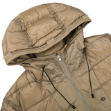 Close-up of a Ten C Beige Nylon Down Padded Liner Hood Jacket, featuring a silver front zipper and black drawstrings. The jacket has a quilted pattern, appears to be made of shiny, insulated fabric, and includes goose down filling for extra warmth.