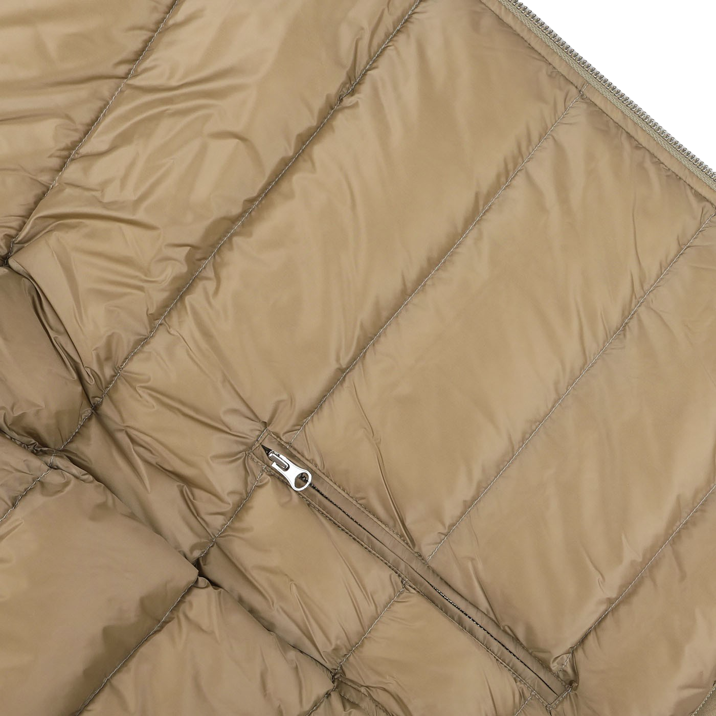 Close-up view of the Beige Nylon Down Padded Liner Hood Jacket by Ten C, featuring stitching and a horizontal zipper pocket on its surface.