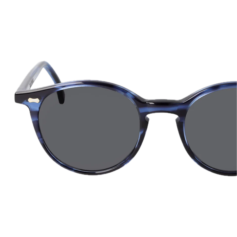 Pair of Cran Ocean Blue Grey Lenses 49mm round-frame sunglasses on a black background, crafted from bio acetate by The Bespoke Dudes.