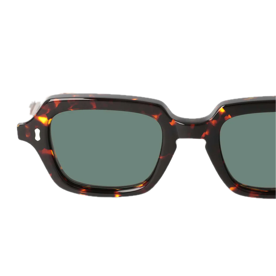 Tortoiseshell square-shaped sunglasses with dark lenses isolated on a black background by The Bespoke Dudes.
