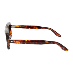 A pair of square-shaped tortoiseshell patterned sunglasses with translucent frames and no lenses, isolated on a black background. Oak Eco Spotted Havana Bottle Green Lenses 49mm by The Bespoke Dudes.