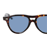 Piquet Eco Dark Havana Blue Lenses 49mm sunglasses by The Bespoke Dudes isolated on a black background, featuring a bio-acetate frame.
