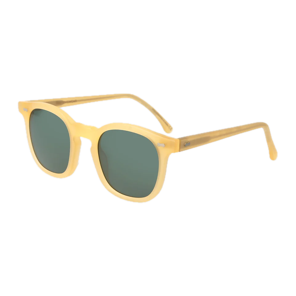 A pair of handmade, Twill Matte Champagne Green Lenses 49mm sunglasses with tinted lenses isolated on a black background by The Bespoke Dudes.